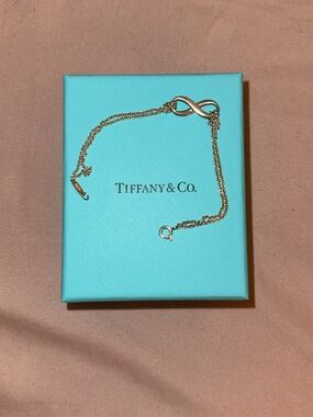 Tiffany & Co. Gold Infinity Bracelet on Blue Box